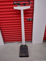 Full standing view of the vintage Healthometer mechanical beam scale with platform and measuring beam