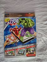 Front packaging of the Marvel Avengers Crayola Colour Alive 2.0 kit showing Hulk and Iron Man with a tablet on screen demonstration.