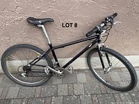 Full side profile of the whole bike showing frame, tires, saddle, and handlebars.