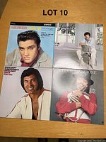 Four LP vinyl record covers showing Elvis Presley (Loving You), Larry Gatlin (Can't Slow Down), Engelbert Humperdinck (Sings For You), and Chuck Mangione.