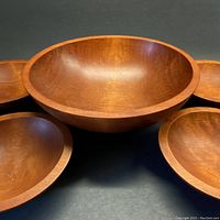 Front view of set including 1 large and 4 small Baribocraft maple wood bowls
