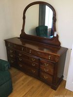 Full side view of the dresser with mirror attached, showing overall design and size.