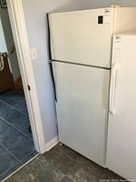 Front view of the white Admiral refrigerator showing both freezer and refrigerator doors