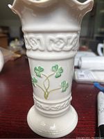 Side view of the vase showing the shamrocks and raised Celtic knot pattern.