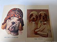 Two signed antique dog cartoon cards by Robert Dickey, showing dogs in human conditions. Both cards measure about 3 by 4 inches.