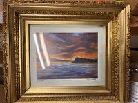 Overall view of framed print showing the image and ornate frame in place.