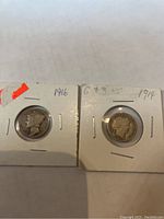 Obverse view of the 1916 and 1914 US Mercury dimes showing date and design details.