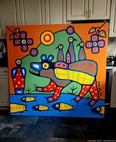 Full front view of painting indoors against kitchen cabinets