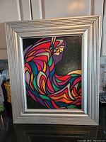 Front view of framed painting showing full artwork and frame condition