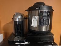 Starfrit Instant Pot and Breville Nespresso coffee maker side by side on countertop.