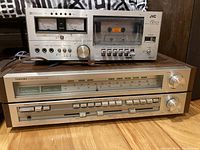 JVC KD-15 cassette deck stacked on Toshiba SA-520 receiver, showing front face and controls.