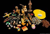 Full lot view of antique and vintage toys and small collectibles on black background