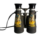 Front view of the binoculars showing Hopalong Cassidy artwork on each side, strap visible.