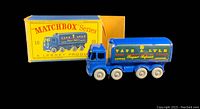 Blue vintage die-cast toy sugar tanker truck with original yellow and blue Matchbox box. Truck displays Tate & Lyle branding on side.