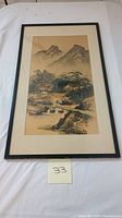 Full view of the framed Asian landscape painting showing the mountain and trees scene on silk.