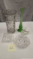 Shows entire lot of cut glass crystal items plus jadeite vase including close size comparison