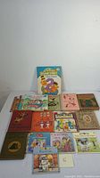 Full view of 15 children's books of various titles including Sesame Street and Disney with colorful illustrated covers.