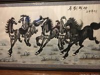 Close-up of the leftmost four horses in motion