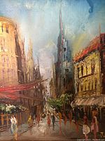 Close-up image of the oil painting showing the detailed cityscape and the artist signature.