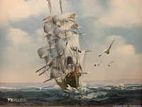Close-up of sail ship painting showing signature and details of the water and birds in the sky.