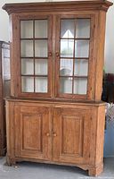 Full view of two-piece pine corner cupboard, front elevation