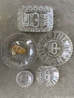 Overview of five antique EAPG glass items commemorating Queen Victoria 1887 Jubilee with etched and molded details and portrait plate with gilt paint.
