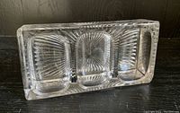 Top-down view of the antique Victorian glass desk organizer showing three compartments with sunburst etched pattern