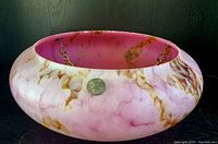 Side view of the pink marbled glass bowl pendant light cover showing the marbled pattern and metal hanging chain attachment.