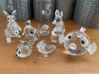 Front view of crystal figurines showing kangaroo, baby, fox, birds and fish