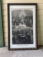Full view of framed antique Queen Victoria Jubilee print leaning against wall