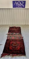Full front view of the vintage Baluch Afghan carpet saddle bag showing overall design and condition