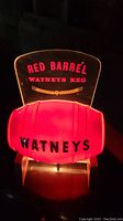 Illuminated Red Barrel Watneys Keg beer advertisement lamp with glowing red barrel and text visible