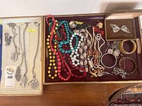 Full overview of lot containing Norway pewter jewelry and costume jewelry including bead necklaces, bracelets, and brooches