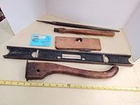 Photo shows group of five vintage wooden handle hand tools including a metal Stanley level and other hand tools with wood handles.