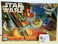 Front view of the sealed model kit box showing Star Wars title, Imperial TIE Fighters art, AMT ERTL logo, and Skill Level 2.
