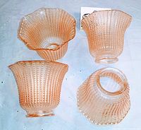 Four vintage iridescent peach amber fluted hobnail glass lamp shades pictured top and side views showing overall shape and texture.