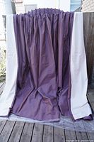 Front view of the purple room darkening curtains fully extended, showing color and length