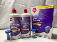 Twin pack of Life brand Lens Care System 3.3% Hydrogen Peroxide Solution with two lens holders and original packaging box showing branding and product details.