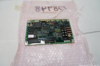 Photo of Mitutoyo main PC board controller on bubble wrap, showing electronic components and connectors.