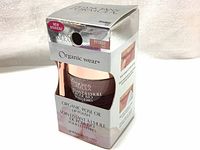 Front view of unopened boxed Organic Rose Oil Lip Polish showing brand and product details.