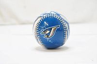 Blue Jays logo on a blue baseball with visible signs of usage and white stitching.