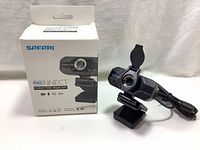 Photo of Safari ProNnect 1080p HD Webcam with retail box showing product branding and basic features.