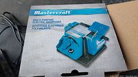 Mastercraft box showing multi-purpose electric sharpener branding in blue and white.