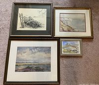 Four framed scenic rustic prints arranged on floor, shows size and framing styles.