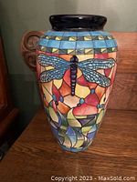 Full view of the vase showing mosaic-style dragonfly and floral pattern