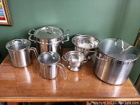 All six pieces arranged on wooden table