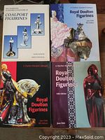 Four reference books laid out, showing the front covers. Two Coalport and two Royal Doulton figurines catalogues.