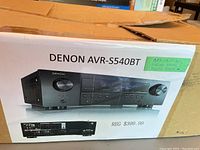 Original packaging box showing Denon AVR-S540BT branding and retail price display