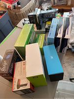 Overview of assorted boxed items on table