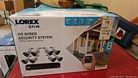 Front of retail box showing Lorex by FLIR branding, 8 camera system, 1080p video resolution, expandable to 16 cameras